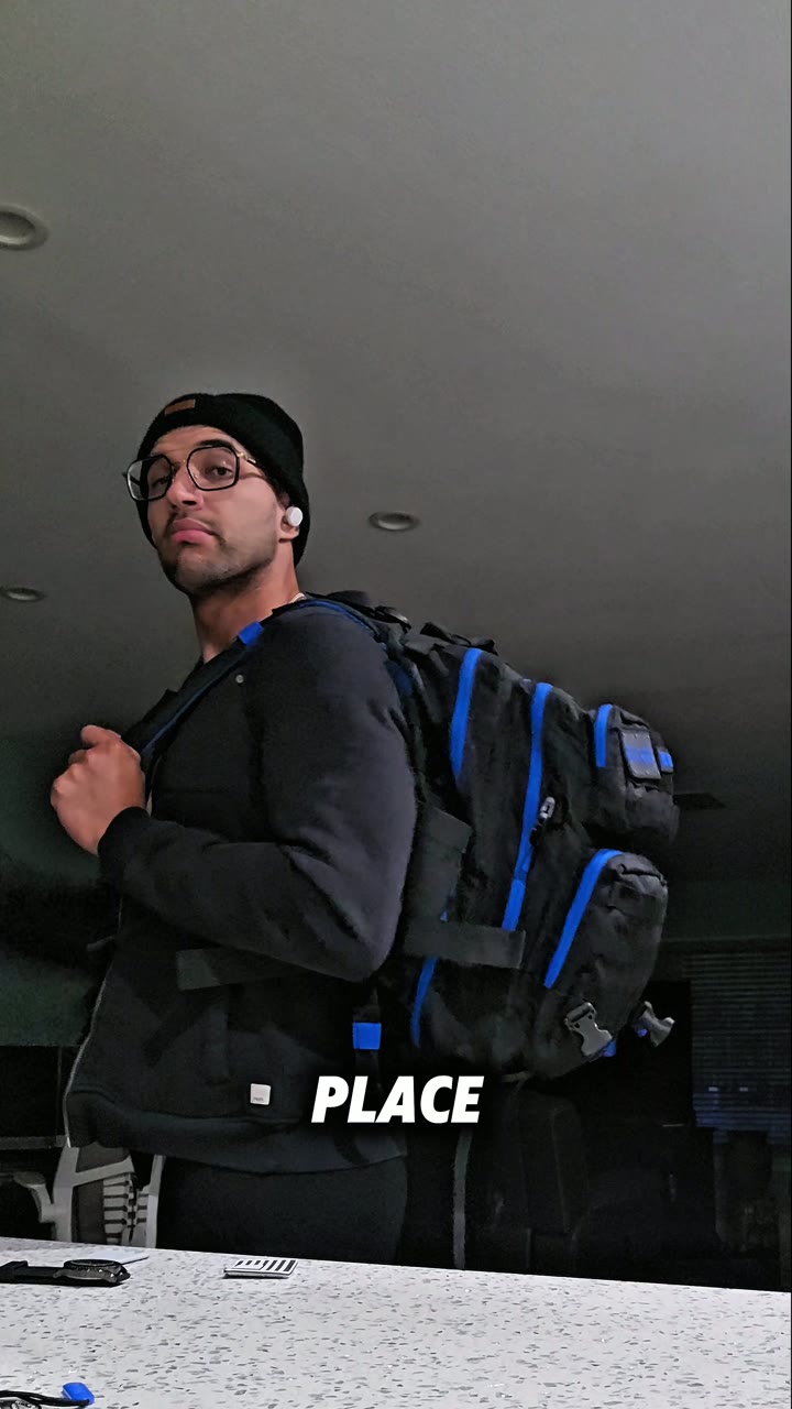 Xavier with the Wolfpak backpack on, mid sentence